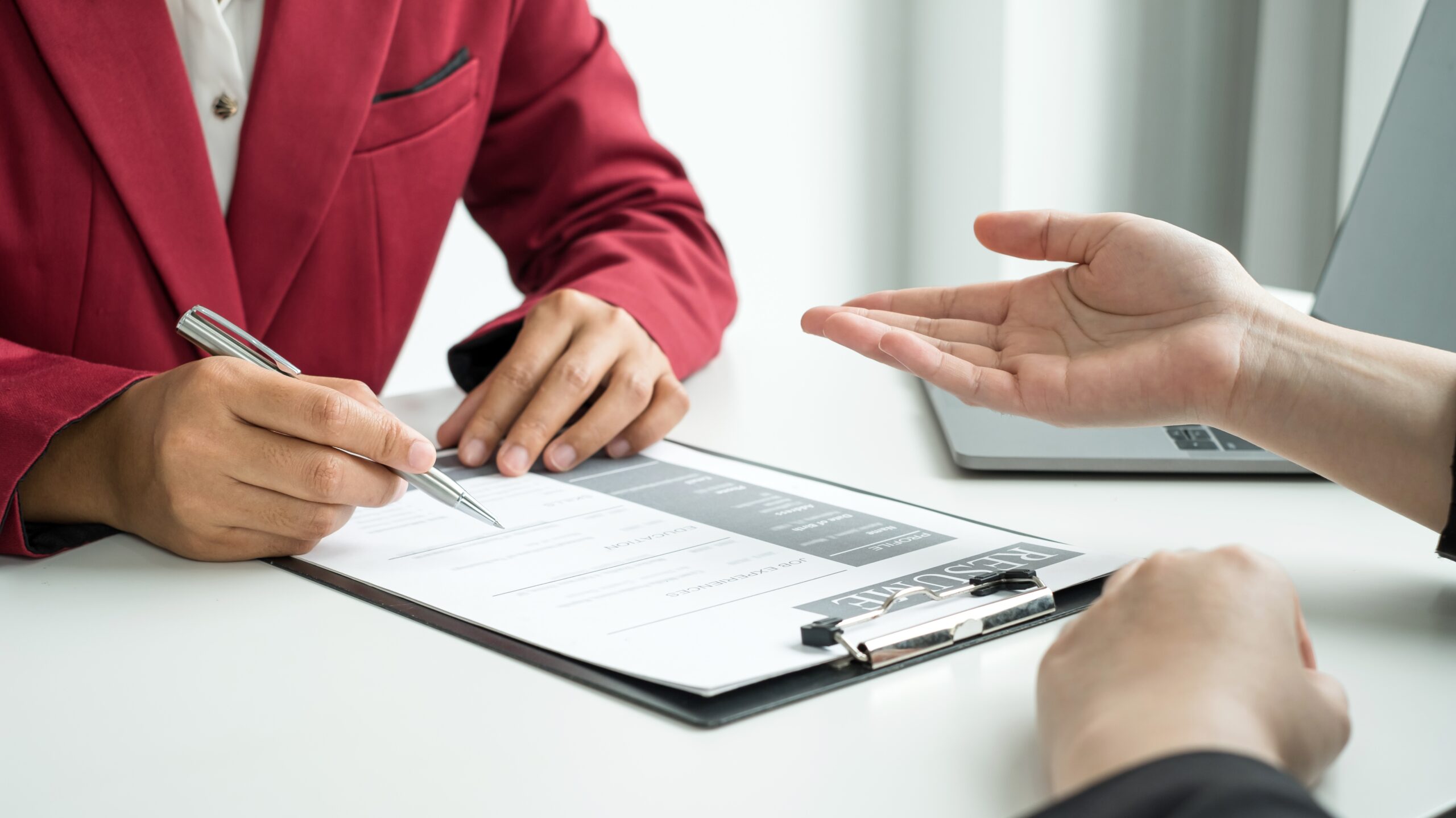 Business people hold a resume and talk to job applicants for job interviews about careers and Their personal history in the company. Recruitment concepts.