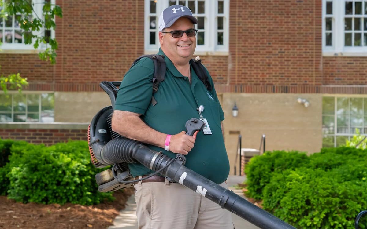 Maintenance worker with a blower at Masonic Homes Kentucky